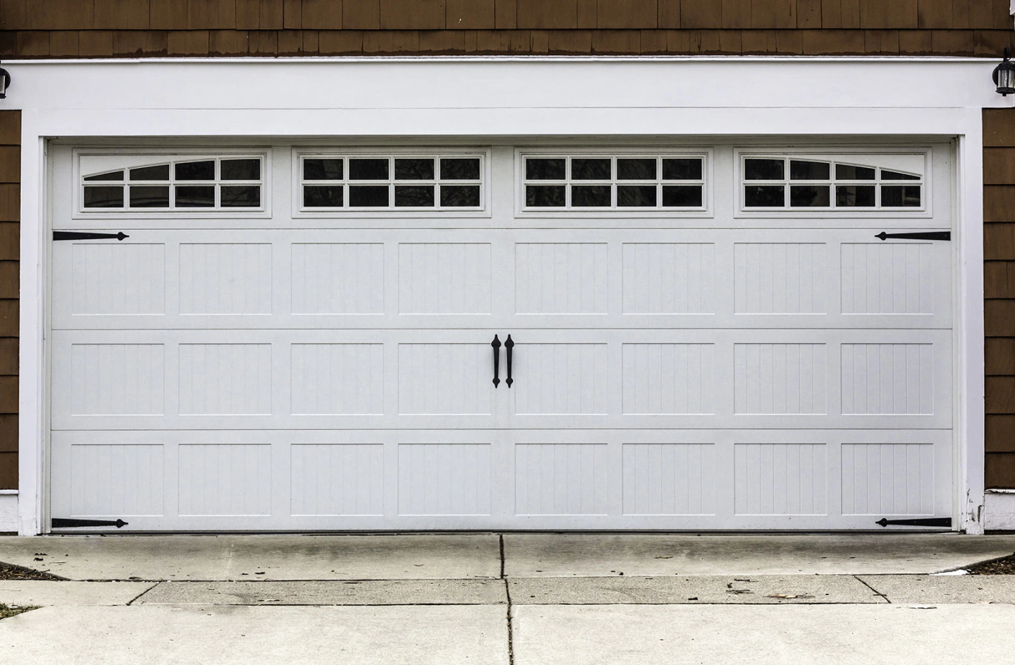white garage door installed at a brown house mint hill nc